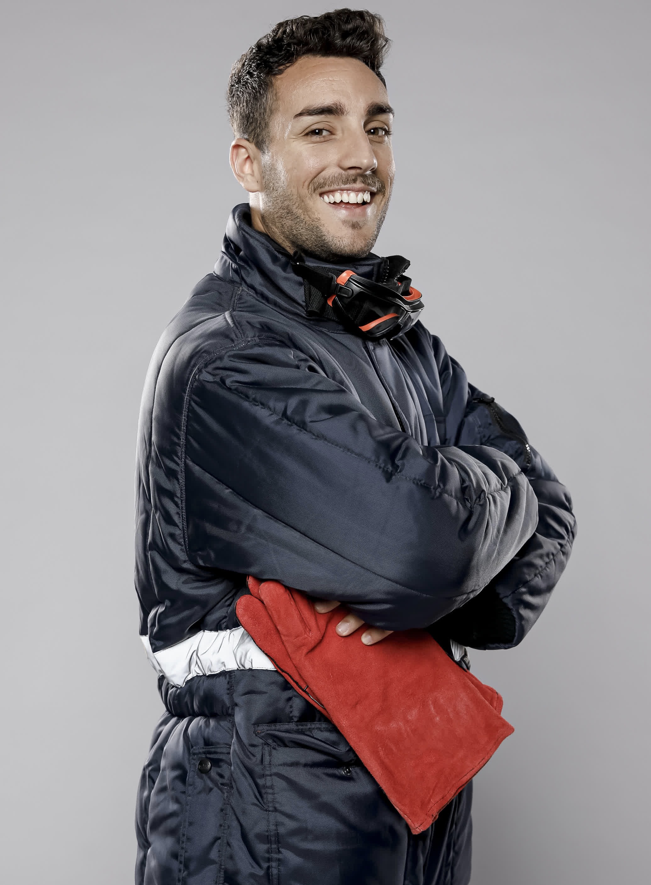 side view-of-smiley-male-worker